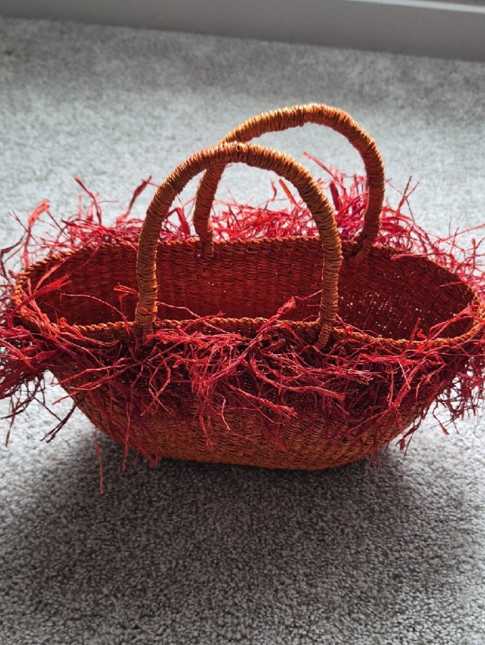 Handwoven Straw Tote with Red Fringe Accents - Picture 2 of 3